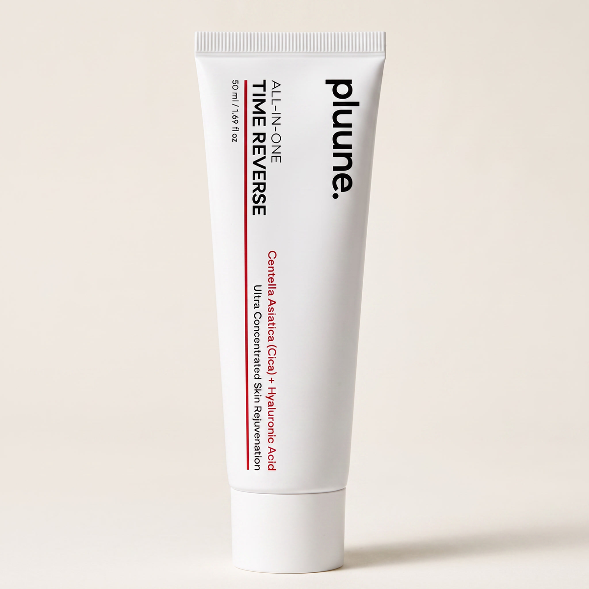 White tube of Pluune All-in-One Time Reverse cream with centella and hyaluronic acid on a beige background