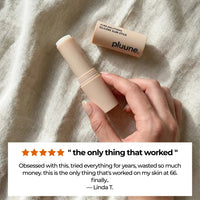 Hand holding an open Pluune stick on linen, with a 5-star review titled "the only thing that worked" from Linda T.