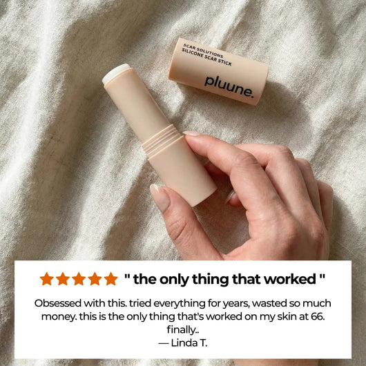 Hand holding an open Pluune stick on linen, with a 5-star review titled "the only thing that worked" from Linda T.